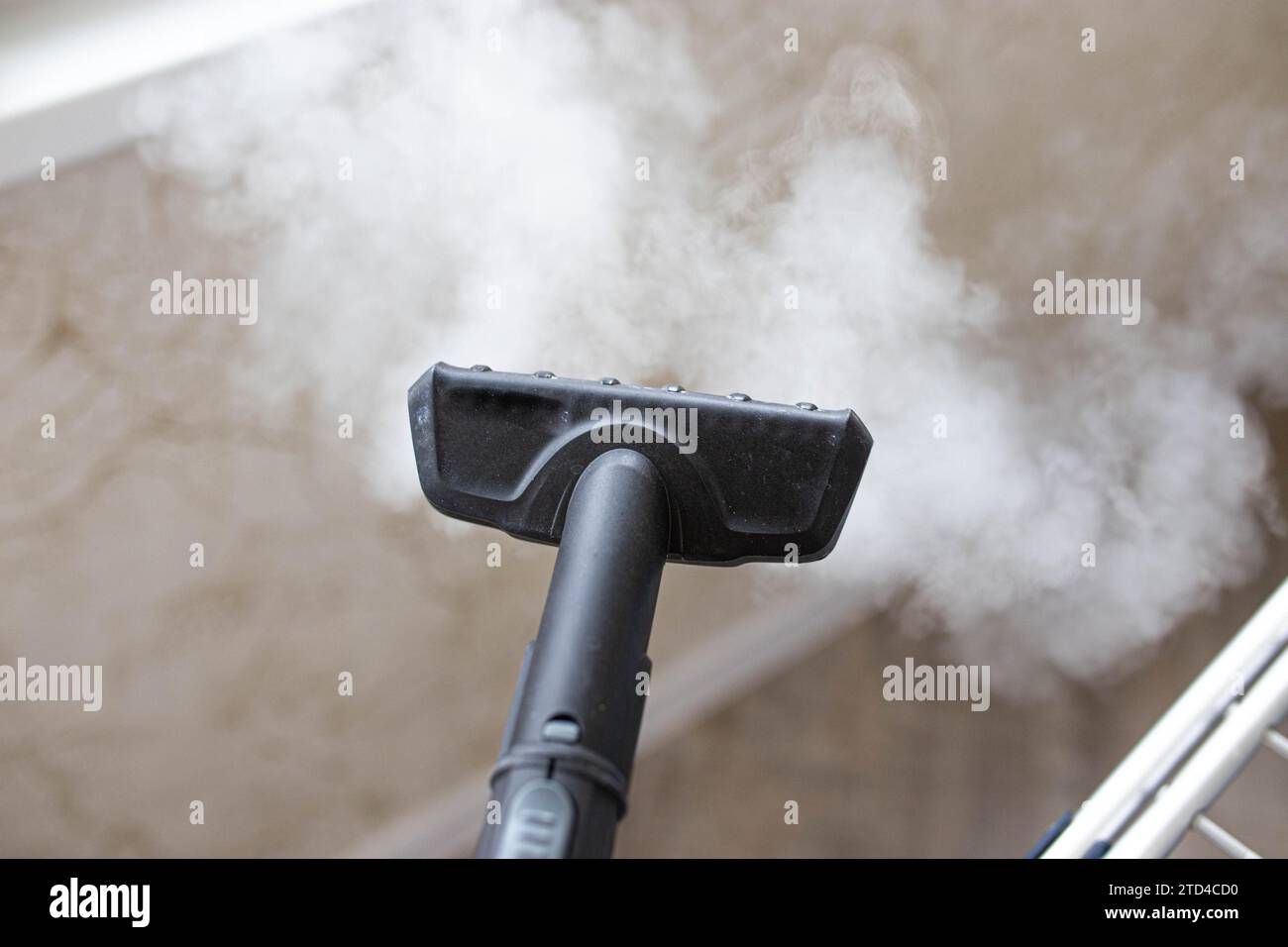 Steamer for cleaning the house, steam under pressure Stock Photo - Alamy