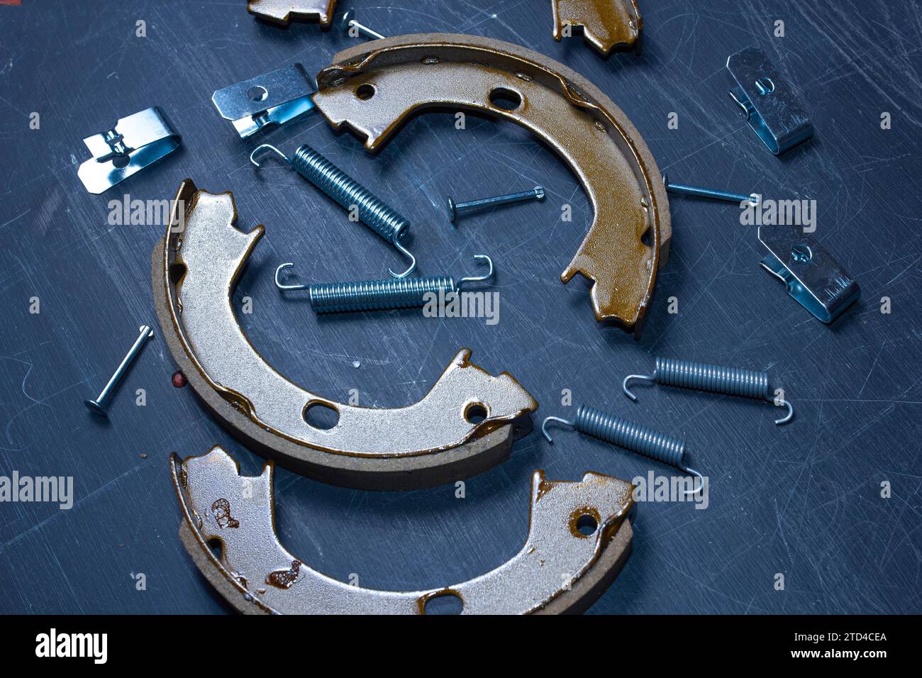 Hand parking brake pad replacement concept, old rusty auto parts are