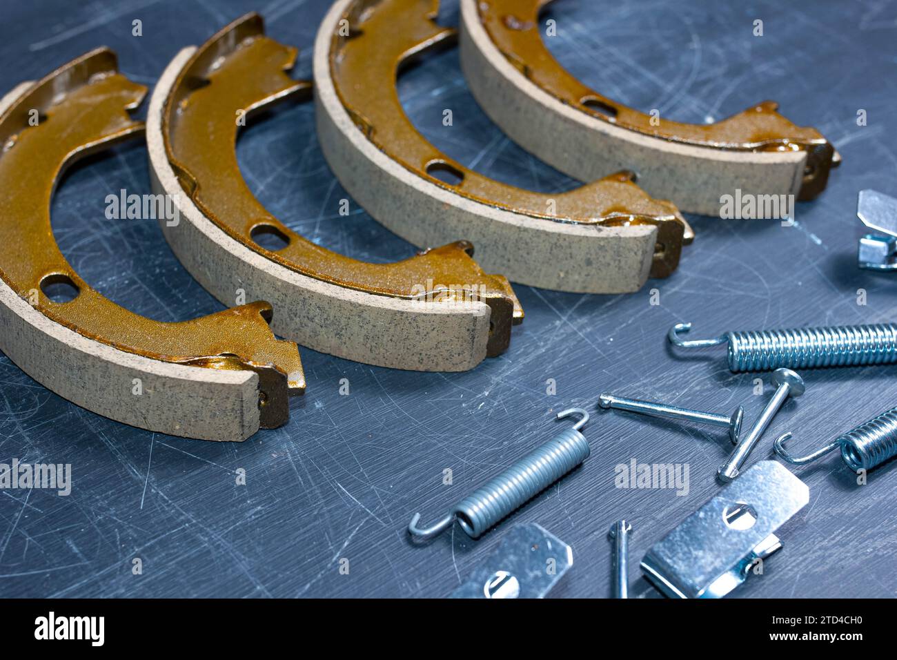 Hand parking brake pad replacement concept, old rusty auto parts are