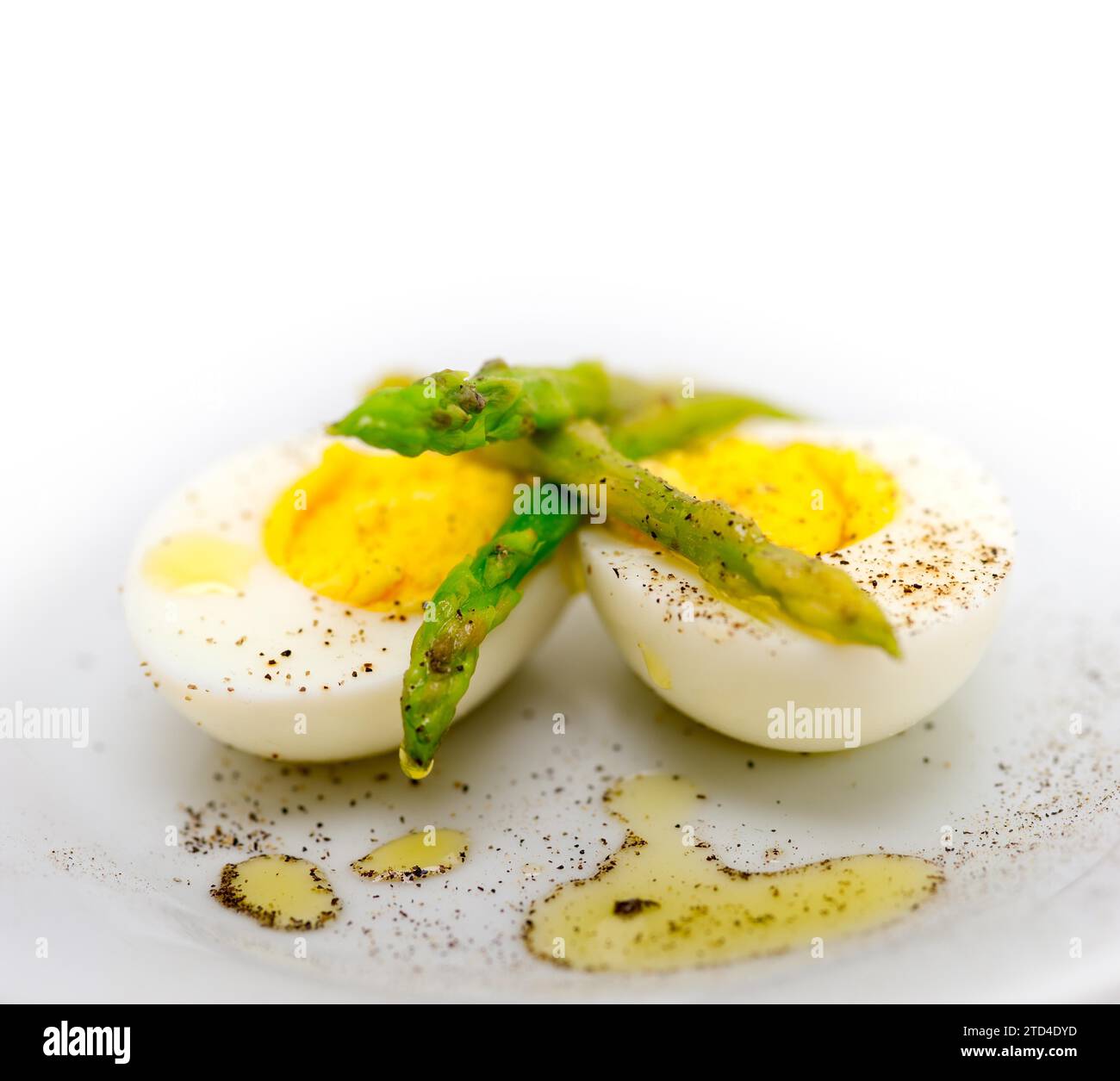 Boiled fresh green asparagus and eggs with extra virgin olive oil Stock ...