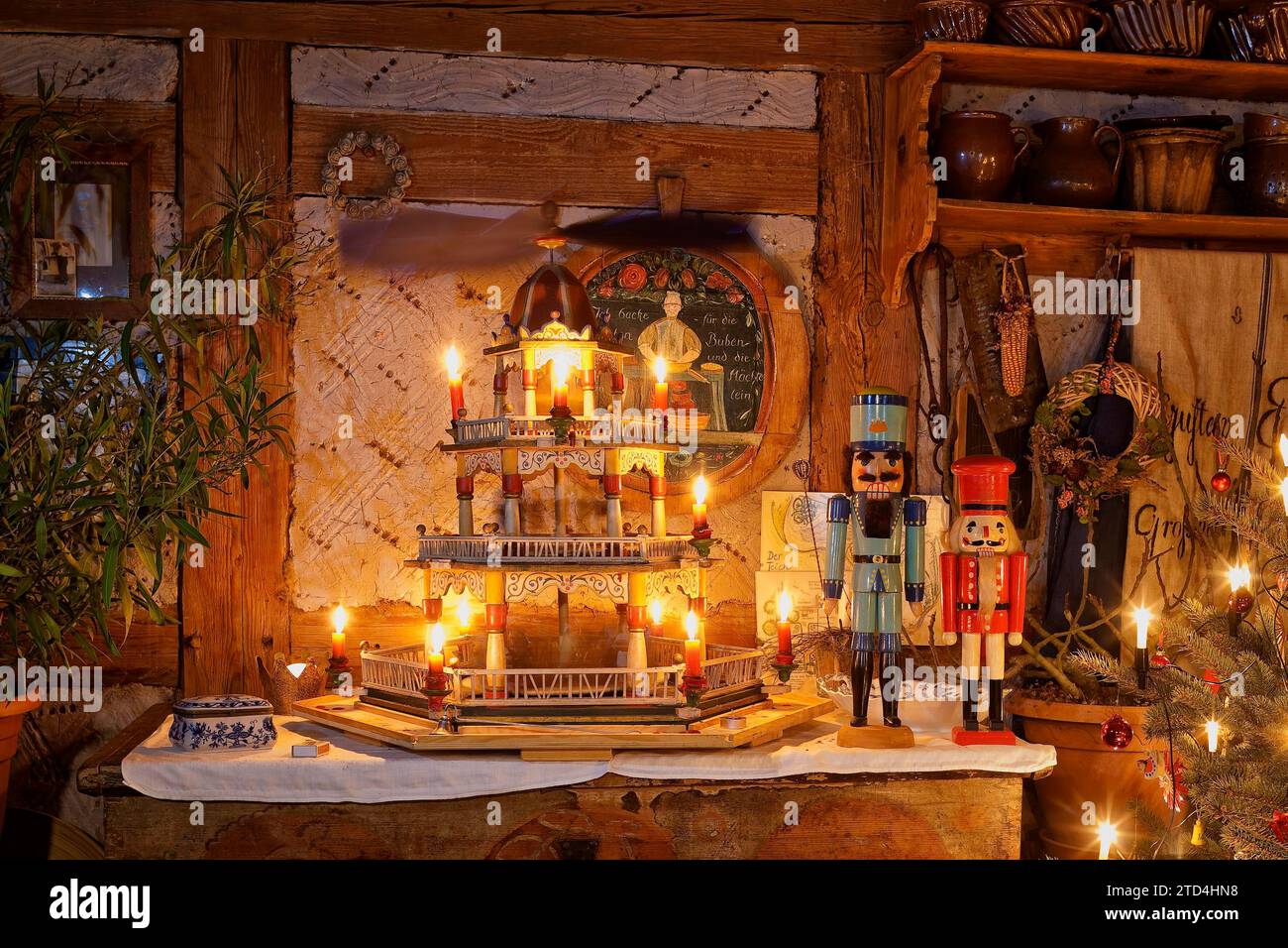 Pyramid from 1880 and Erzgebirge nutcrackers in the Christmassy ambience of a Saxon farmhouse Stock Photo
