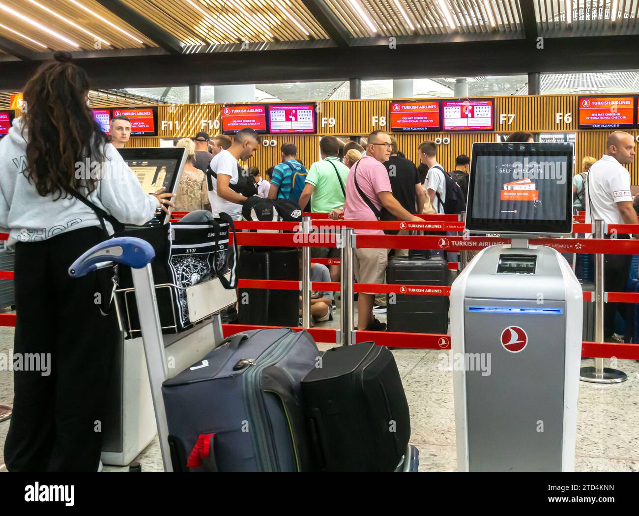 Self check in terminal screen stand in front of turkish airlines check