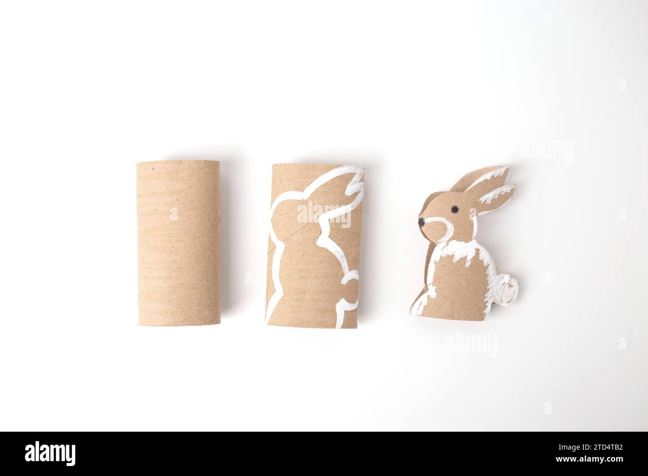 Making Cut Out Rabbits cut out paper rabbit animal tutorial, craft, DIY Stock Photo - Alamy