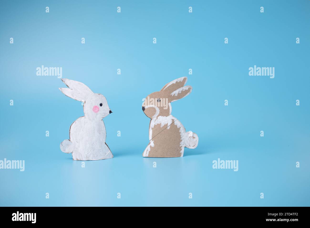Making Cut Out Rabbits cut out paper rabbit animal tutorial, craft, DIY Stock Photo - Alamy
