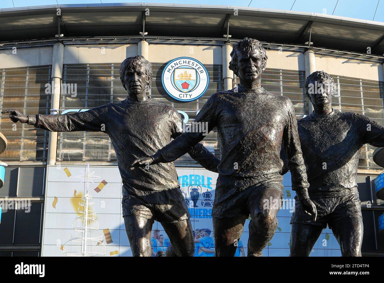 Manchester, United Kingdom, 16th December 2023. The trinity statue outside the Etihad Stadium