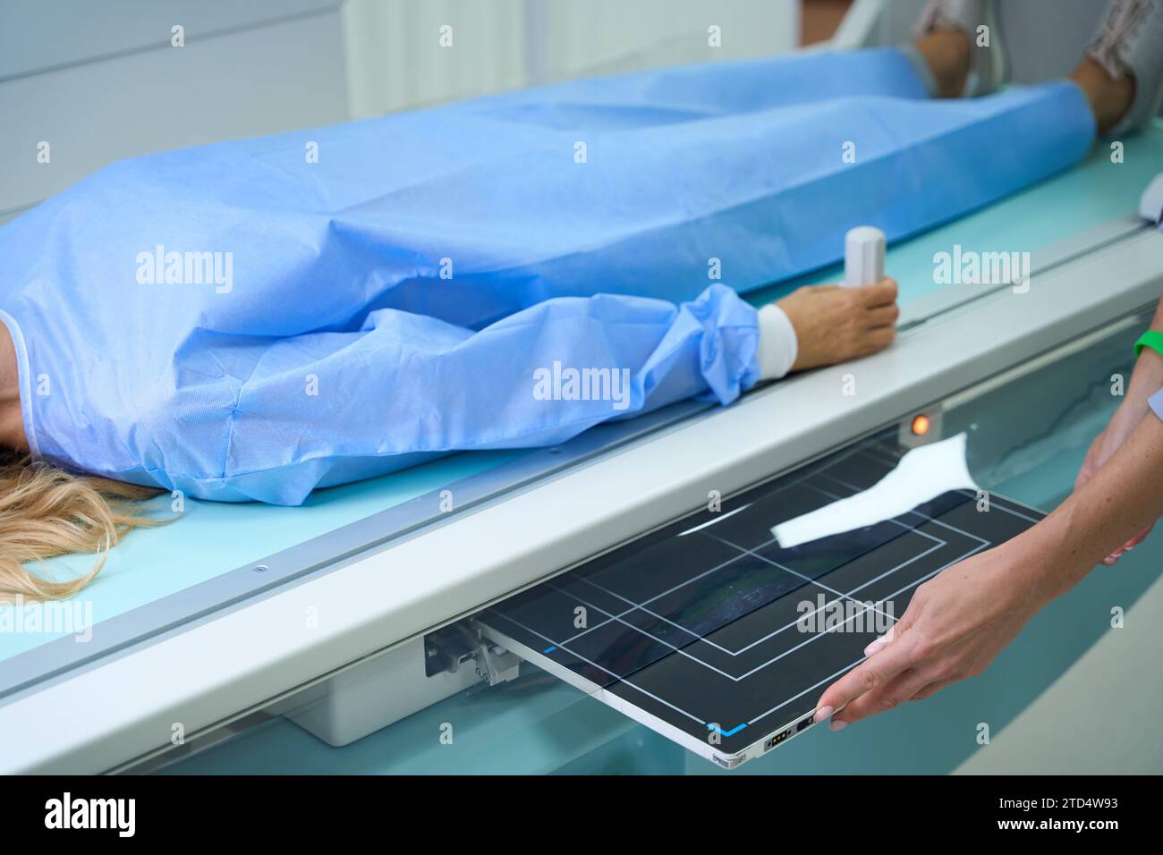 Adult woman being prepared for diagnostic radiography in clinic Stock ...