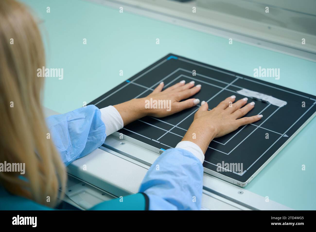 Female patient undergoing radiographic examination of finger joints Stock Photo Alamy