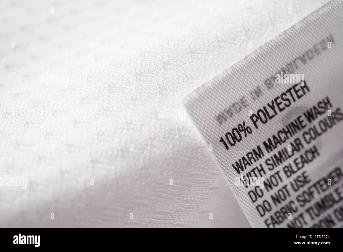 Polyester fabric Clothing label with laundry instructions Stock Photo ...