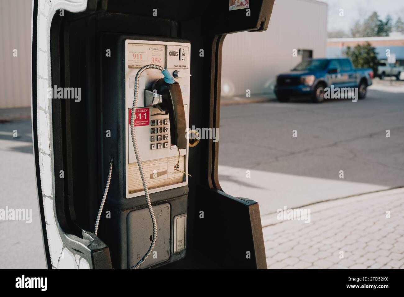 Broken pay telephone in downtown Caro Michigan USA Stock Photo