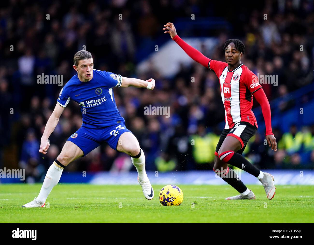 Chelsea's Conor Gallagher (left) and Sheffield United's Andre Brooks battle for the ball during the Premier League match at Stamford Bridge, London. Picture date: Saturday December 16, 2023. Stock Photo