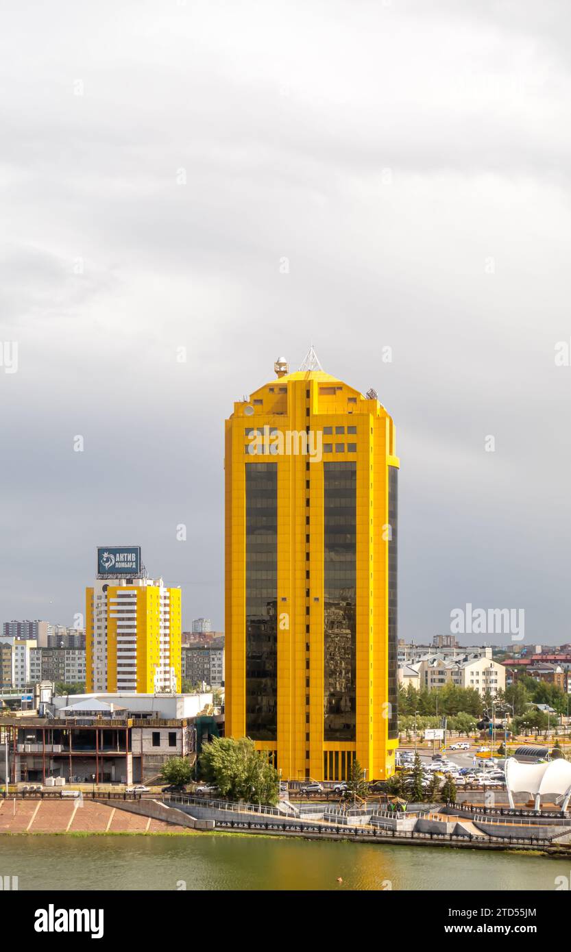 Business Center Astana Tower yellow building on Ishim river Kazakhstan