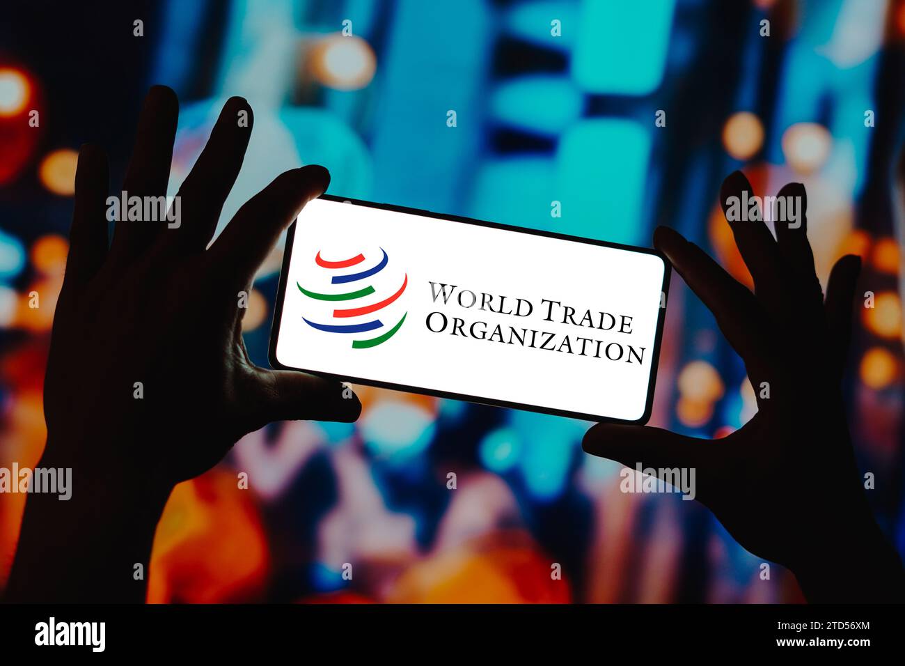 In this photo illustration, the World Trade Organization (WTO) logo is displayed on a smartphone screen. Stock Photo