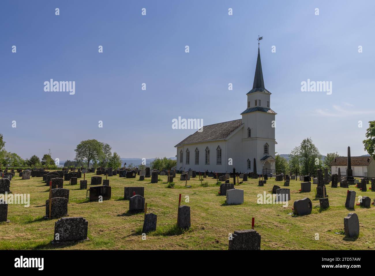 Warm summer sunlight bathes the central entrance of the traditional
