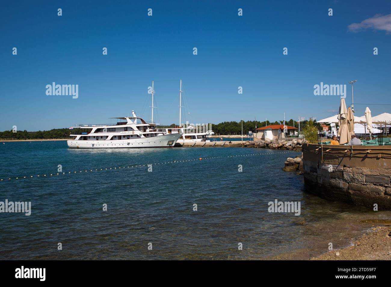 Boat, People, Seaside Restaurant, Old Town,Novigrad, Croatia Stock Photo