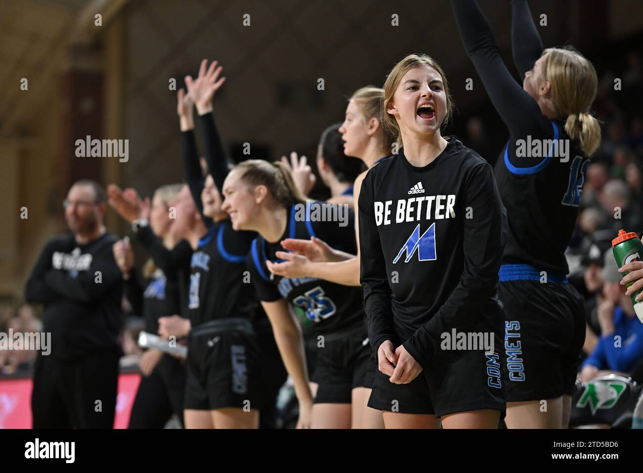 Mayville players celebrate during an NCAA women's preseason basketball