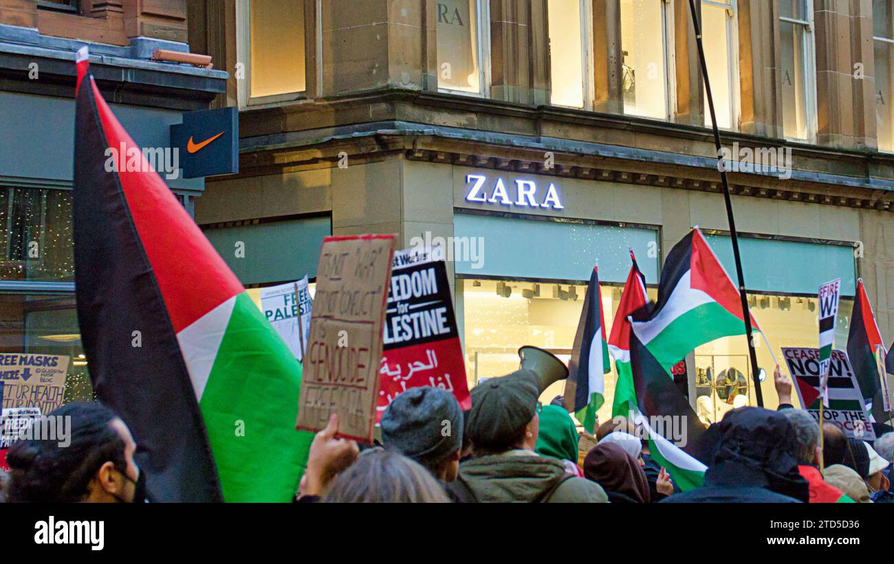 Glasgow, Scotland, UK.16th December, 2023.  Zara customers locked in as Palestinian protesters tool over Buchanan street the style mile and shopping capital of Scotland.  Police blockaded the door as customers were locked inside with others waiting to enter. The crowd moved on and customers were let out at 3.30pm. Credit Gerard Ferry/Alamy Live News Stock Photo