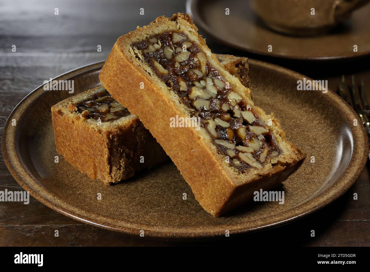Engadine walnut cake on coffee table Stock Photo