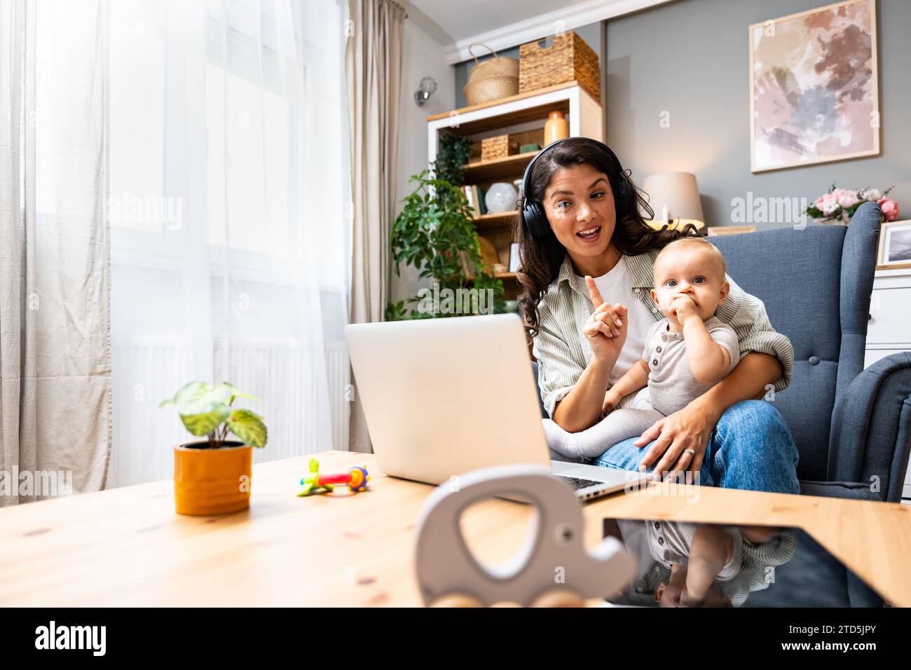 Business woman on maternity leave. Mother with newborn baby working