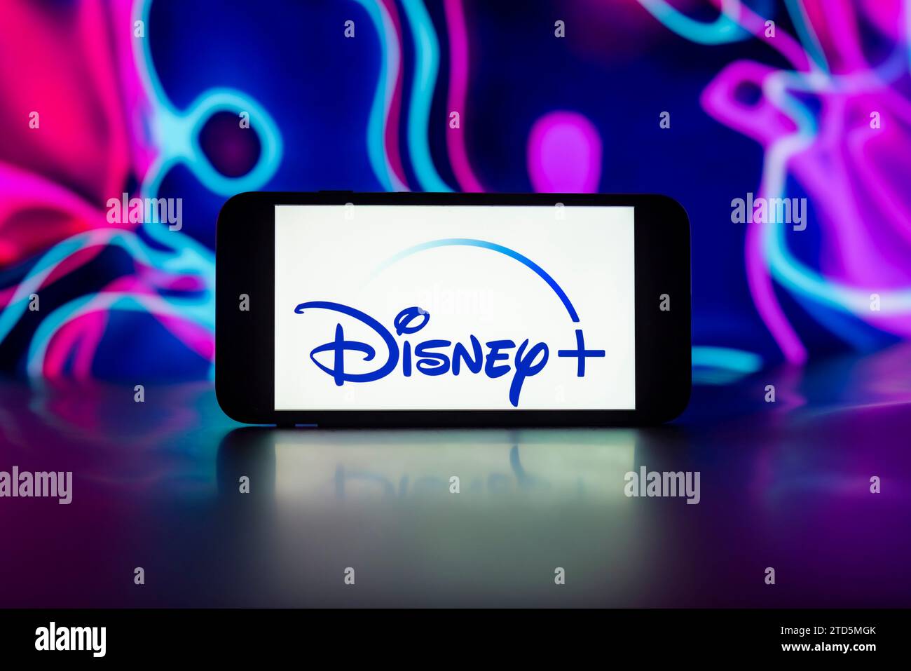 In this photo illustration, the Disney+ logo is seen displayed on a ...