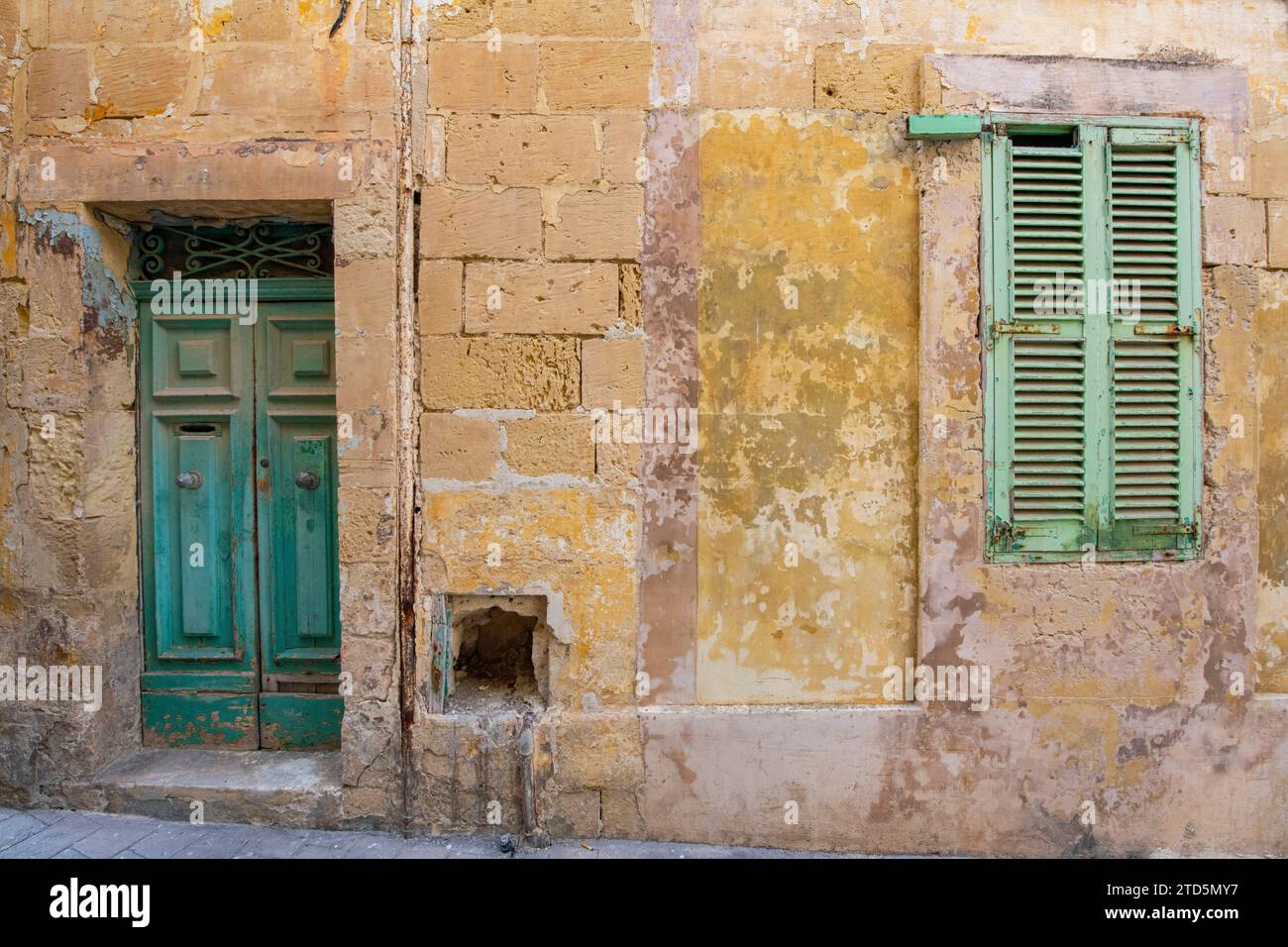 Carmelo Delia House Furnisher - historic facia of old Maltese builidngs in the capital, Valletta. Stock Photo