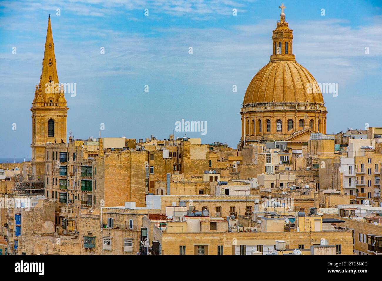 The steep streets of Valletta and Basilica of Our Lady of Mount Carmel Stock Photo