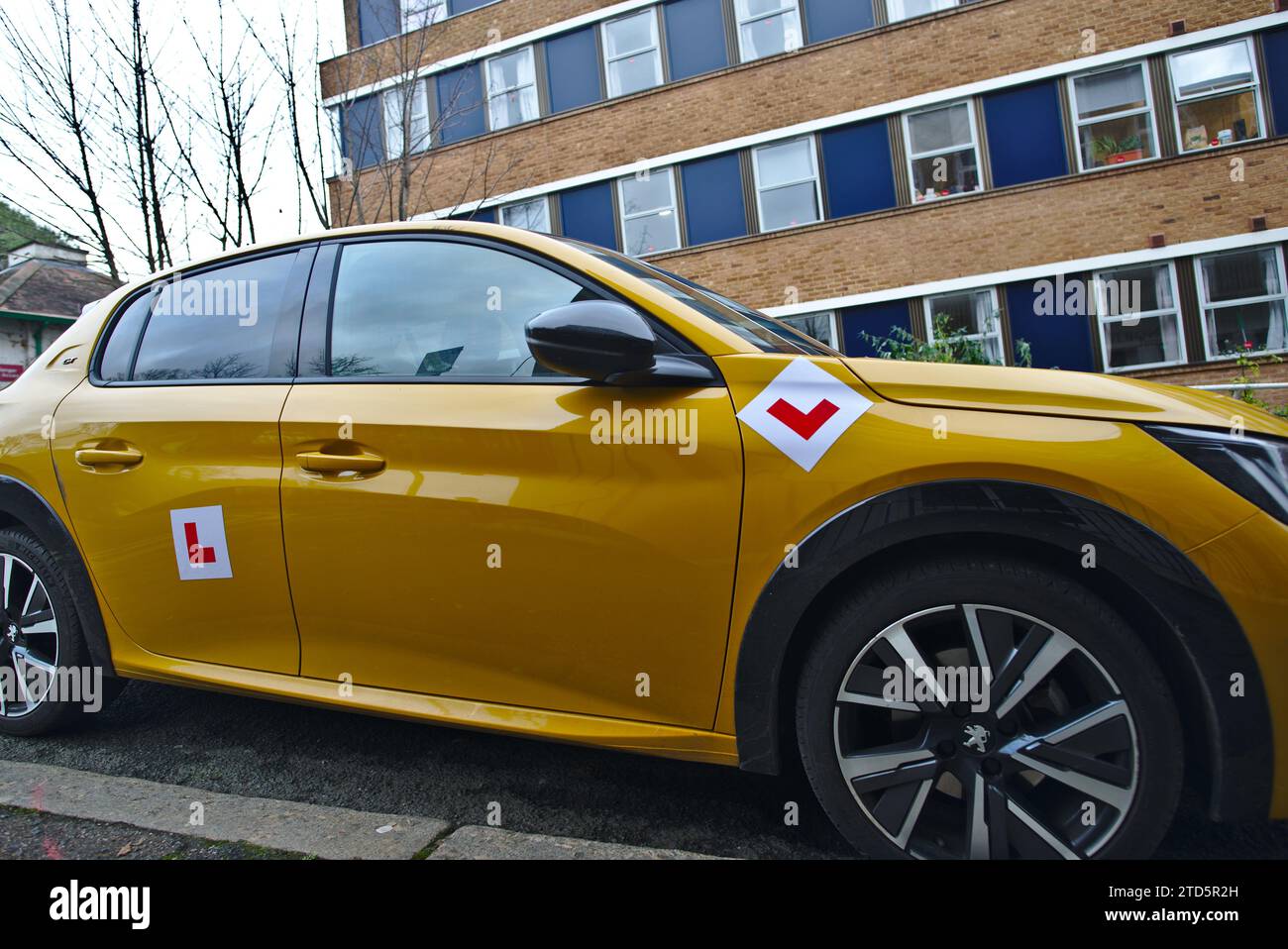L plates on a learner driver car to e displayed while the new driver is learning before they have passed their driving test. Stock Photo