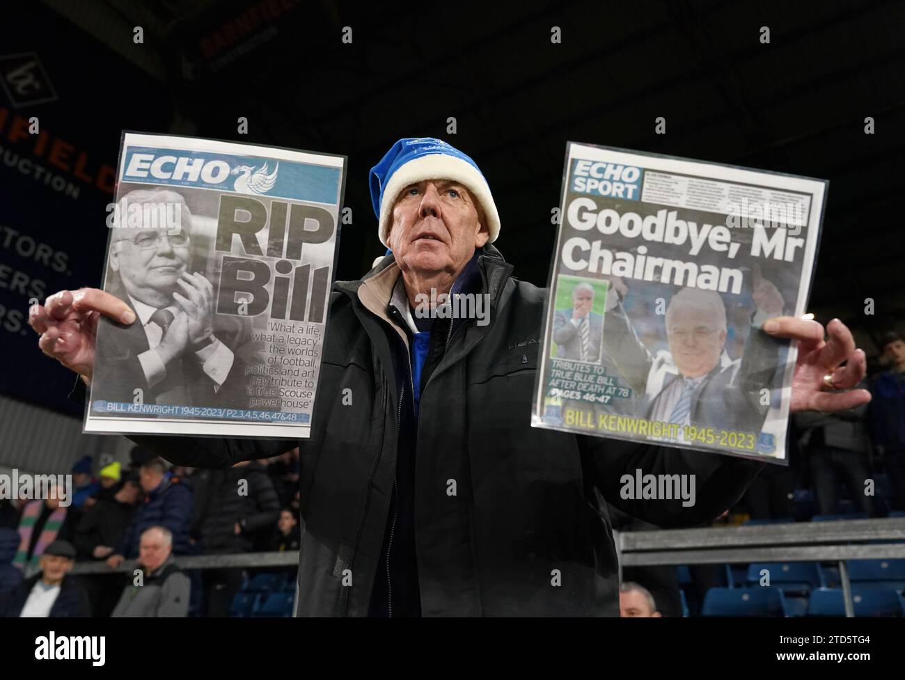 Everton fan holds up papers in memory of the late Everton chairman Bill Kenwright during the Premier League match at Turf Moor, Burnley. Picture date: Saturday December 16, 2023. Stock Photo