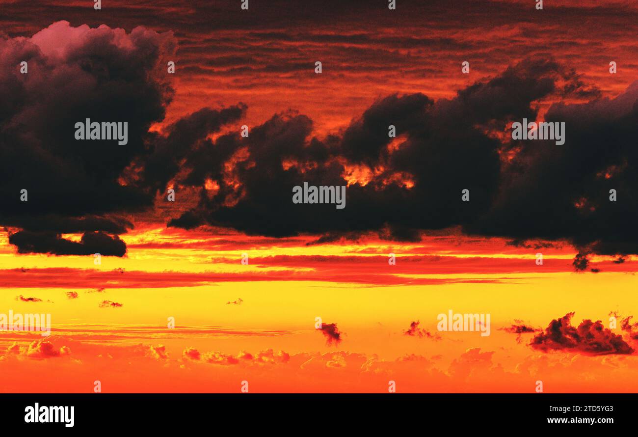 dramatic cloudy sky at fiery sunset Stock Photo