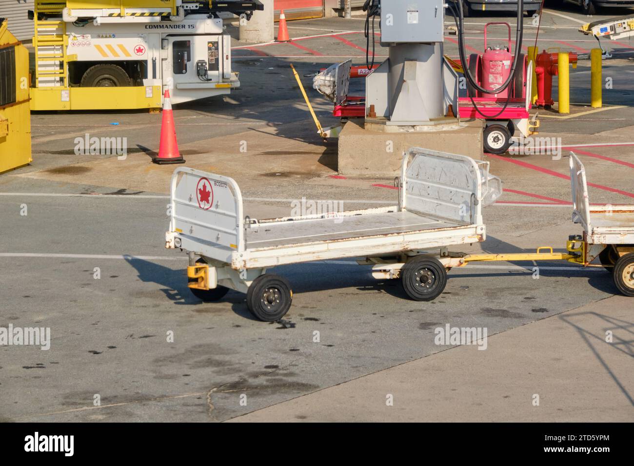 Empty Air Canada Luggage mover on the runaway of airport Stock Photo