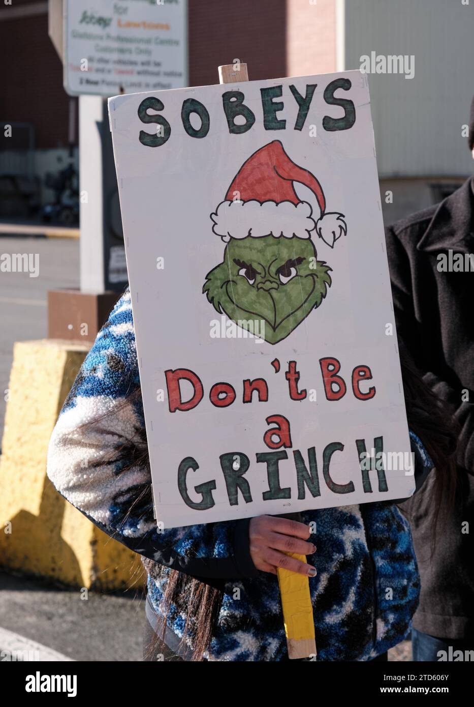 Sign by Sobeys Grocery Corporation Striking employee, against corporate greed Stock Photo