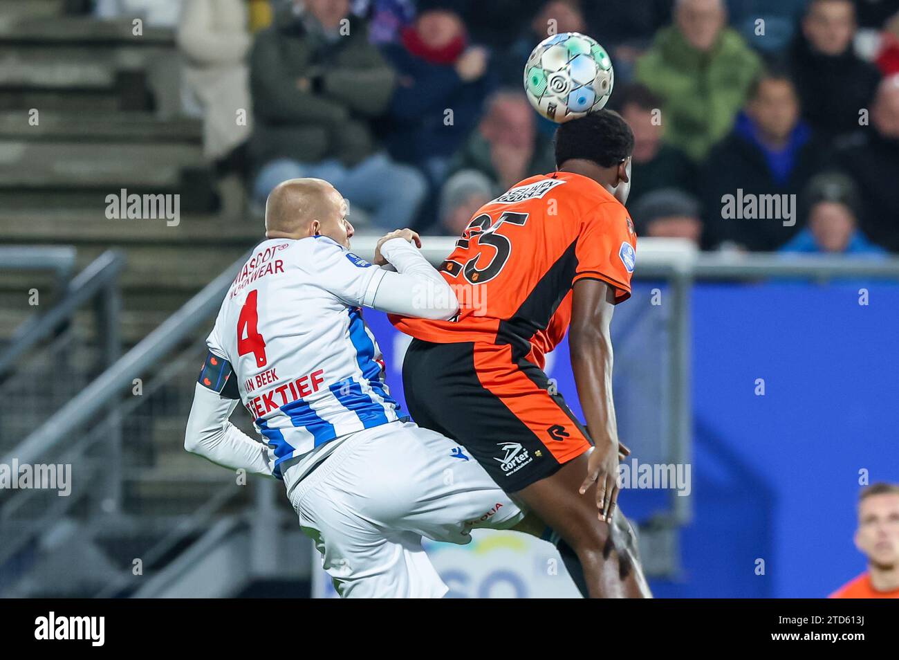 HEERENVEEN, NETHERLANDS - DECEMBER 16: Sven van Beek of SC Heerenveen competes for the headed ball with Lequincio Zeefuik of FC Volendam during the Dutch Eredivisie match between SC Heerenveen and FC Volendam at Abe Lenstra Stadion on December 16, 2023 in Heerenveen, Netherlands. (Photo by Pieter van der Woude/Orange Pictures) Stock Photo