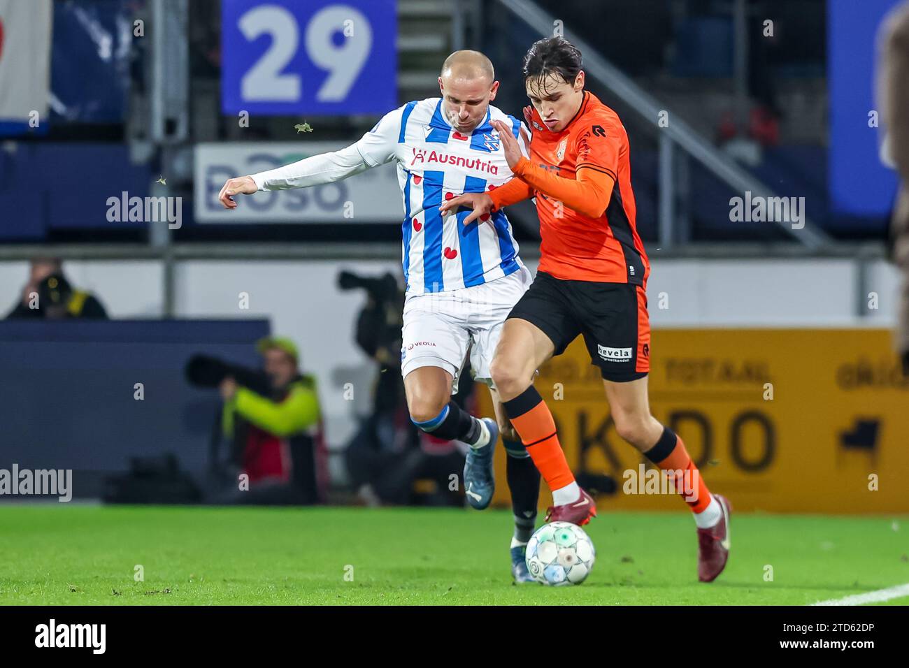 HEERENVEEN, NETHERLANDS - DECEMBER 16: Josh Flint of FC Volendam is challenged by Sven van Beek of SC Heerenveen during the Dutch Eredivisie match between SC Heerenveen and FC Volendam at Abe Lenstra Stadion on December 16, 2023 in Heerenveen, Netherlands. (Photo by Pieter van der Woude/Orange Pictures) Stock Photo