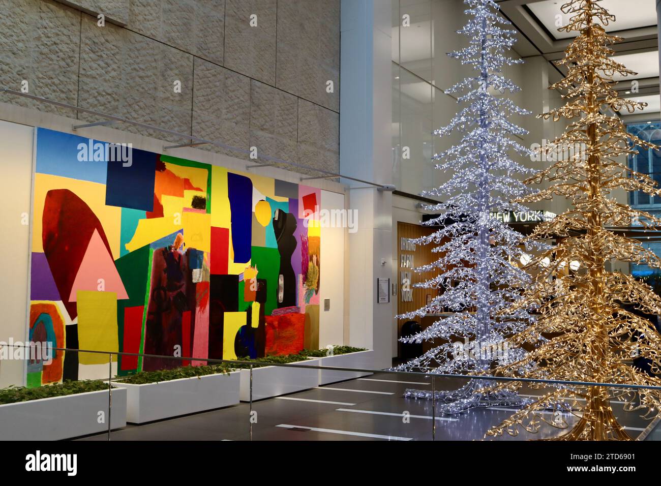 Large painting and Christmas trees in the lobby of Olympic towers on