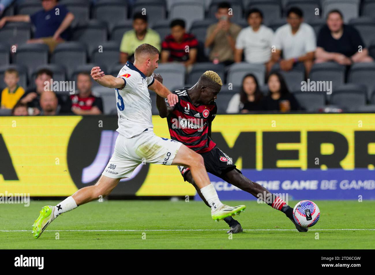 Giuseppe Bovalina of Adelaide United competes for the ball with Valentino Yuel of the Wanderers during the A-League Men Rd8 between the Wanderers and Stock Photo