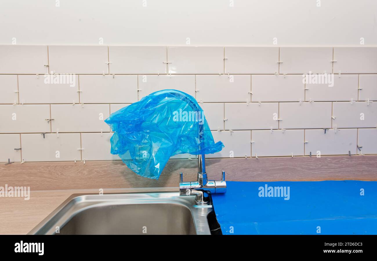 Tile Socket New tile installation in kitchen with electrical sockets removed Stock ...