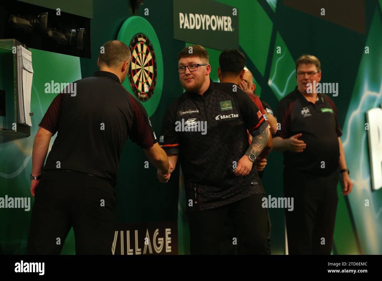 London, UK. 16th December 2023,  Alexandra Palace, London, England; 2023/24 PDC Paddy Power World Darts Championships Day 2 Evening Session; Keane Barry shakes hands with a scoring official after his match against Reynaldo Rivera. Credit: Action Plus Sports Images/Alamy Live News Stock Photo