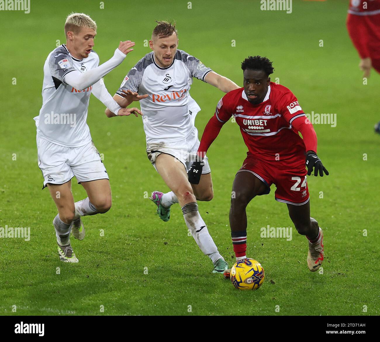 Swansea, Wales, UK. 16th Dec, 2023. Alex Bangura of Middlesbrough breaks away from Jay Fulton (l) & Harry Darling of Swansea City . EFL Skybet championship match, Swansea city v Middlesbrough at the Swansea.com Stadium in Swansea, Wales on Saturday 16th December 2023. this image may only be used for Editorial purposes. Editorial use only, pic by Andrew Orchard/Andrew Orchard sports photography/Alamy Live news Credit: Andrew Orchard sports photography/Alamy Live News Stock Photo