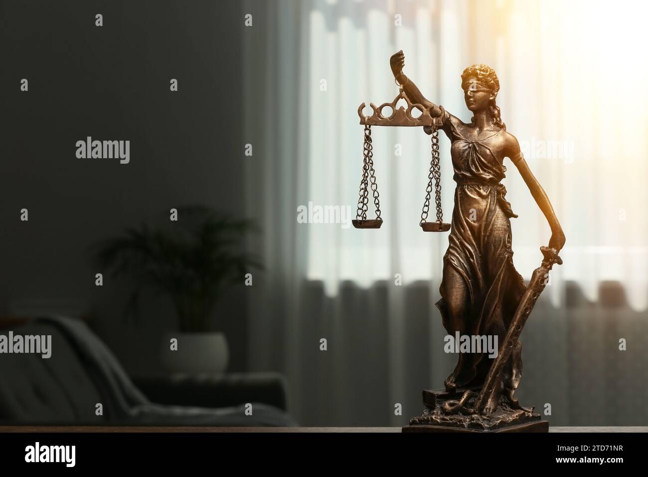 Symbol of fair treatment under law. Statue of Lady Justice indoors, space for text Stock Photo