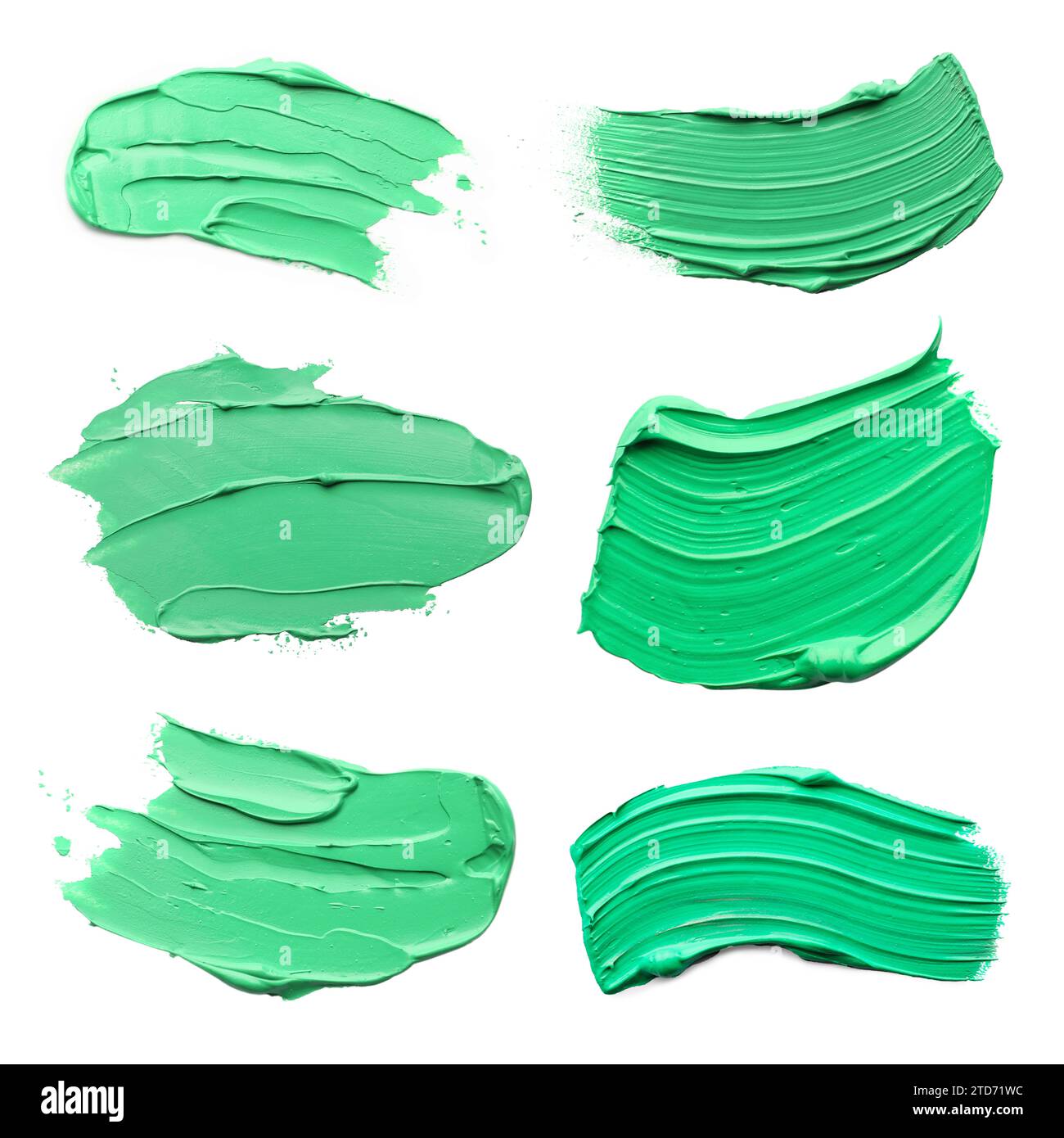 Light green oil paint strokes isolated on white, top view