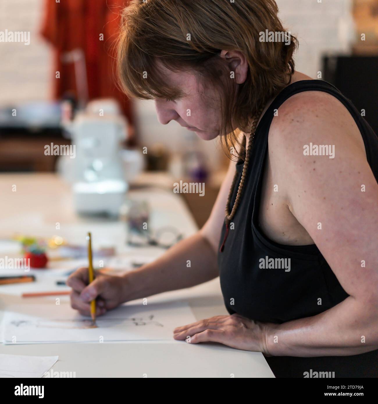 A fashion designer drawing a fashion sketch Stock Photo Alamy