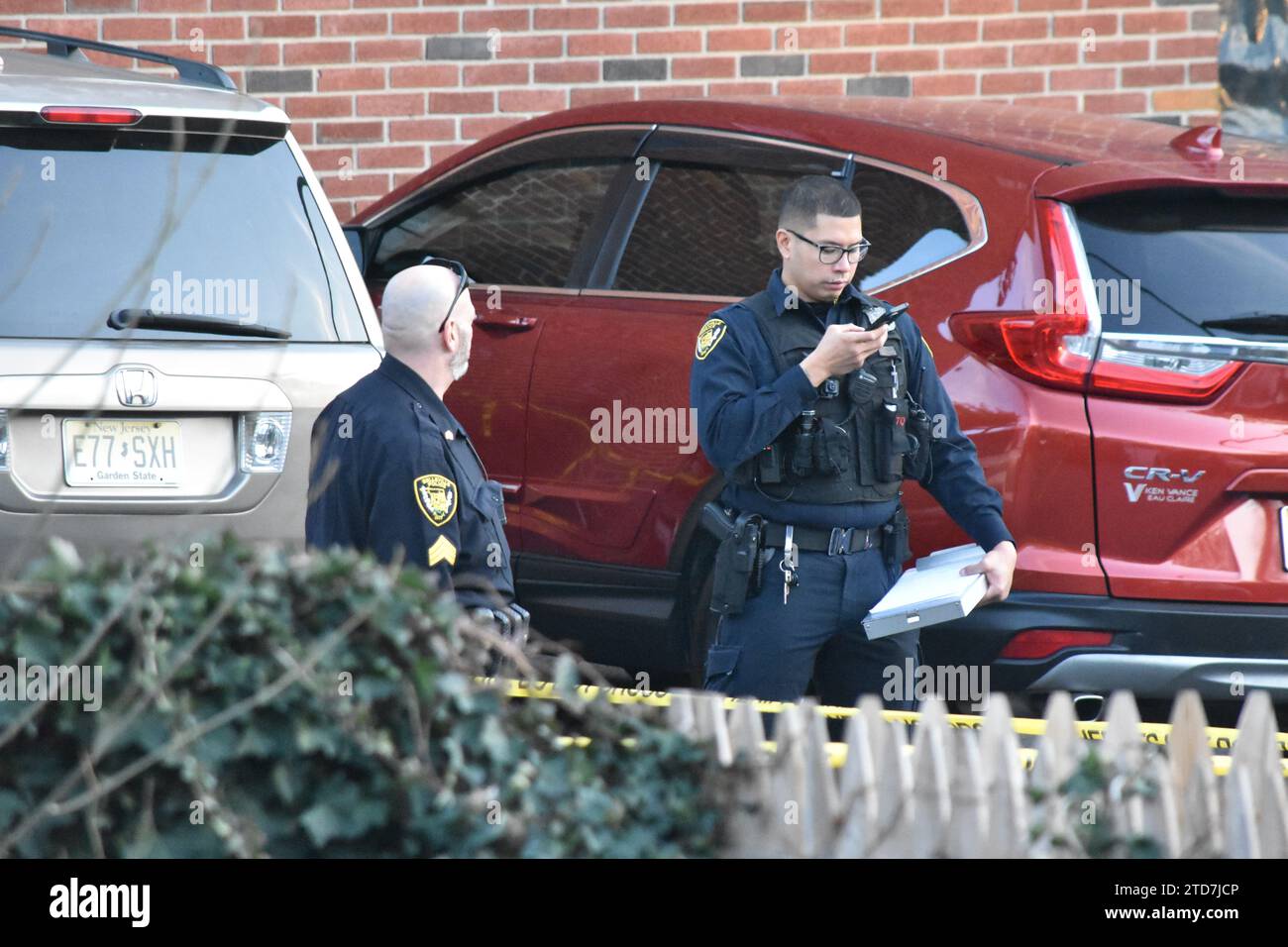 Belleville, New Jersey, USA. 16th Dec, 2023. Police officers search for clues at the crime scene