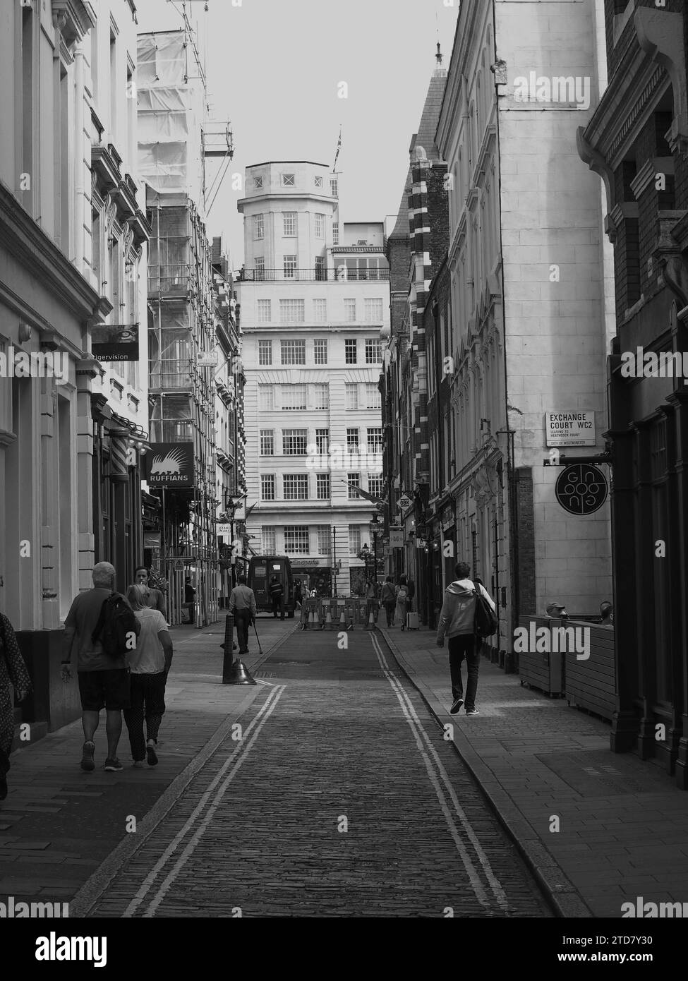 A vertical grayscale shot of a street in the city center Stock Photo ...