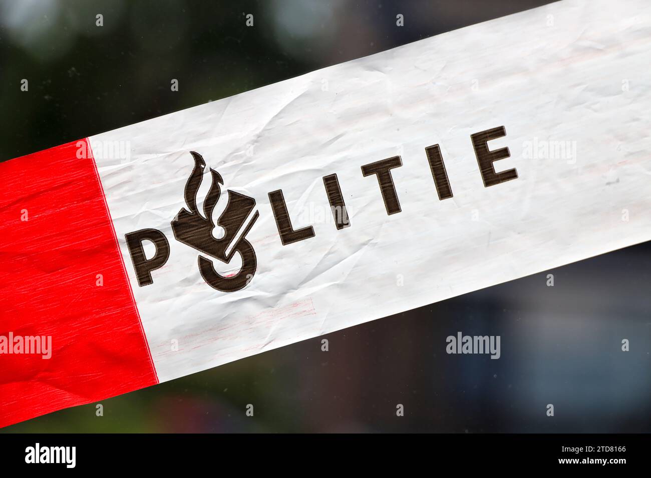 Red and white tape of Dutch police (politie) at incident in the
