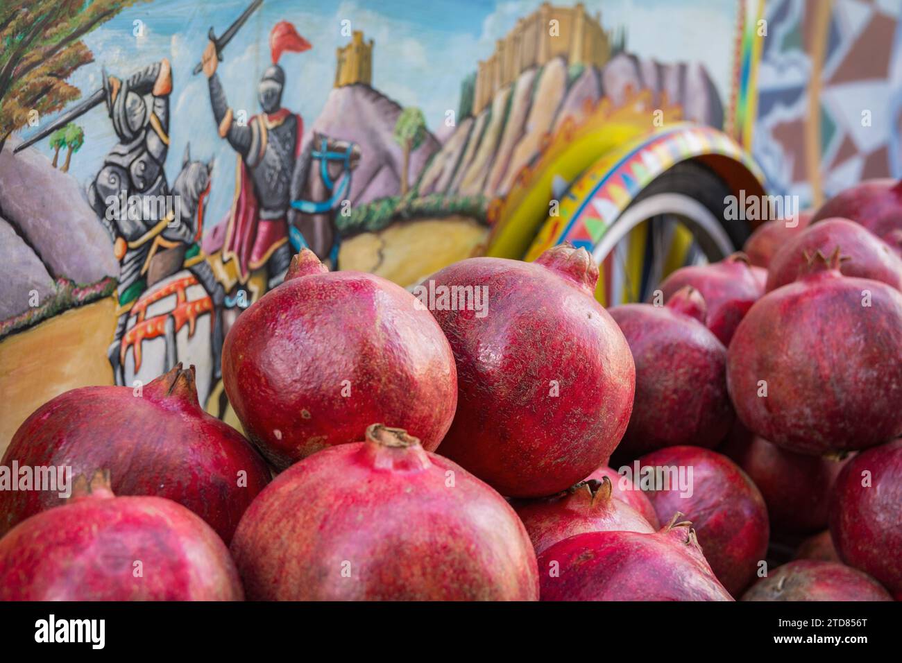 Pomegranates in a picturesque citrus kiosk, Sicily Stock Photo
