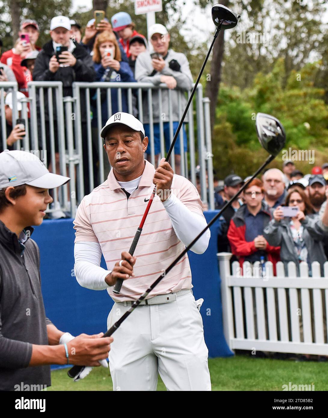 Orlando, United States. 16th Dec, 2023. Tiger Woods and his son, Charlie Woods, wait to tee off on the first hole during the first round of the PNC Championship at the Ritz-Carlton Golf Club in Orlando. Credit: SOPA Images Limited/Alamy Live News Stock Photo