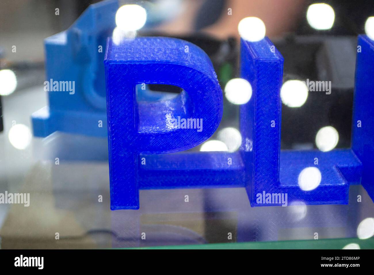 Objects letters printed on 3D printer close-up. Models letter 3D ...