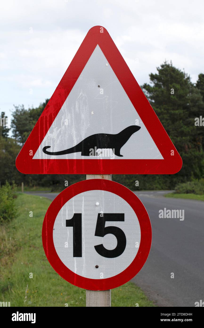 Warning triangle showing presence of Otters. Stock Photo