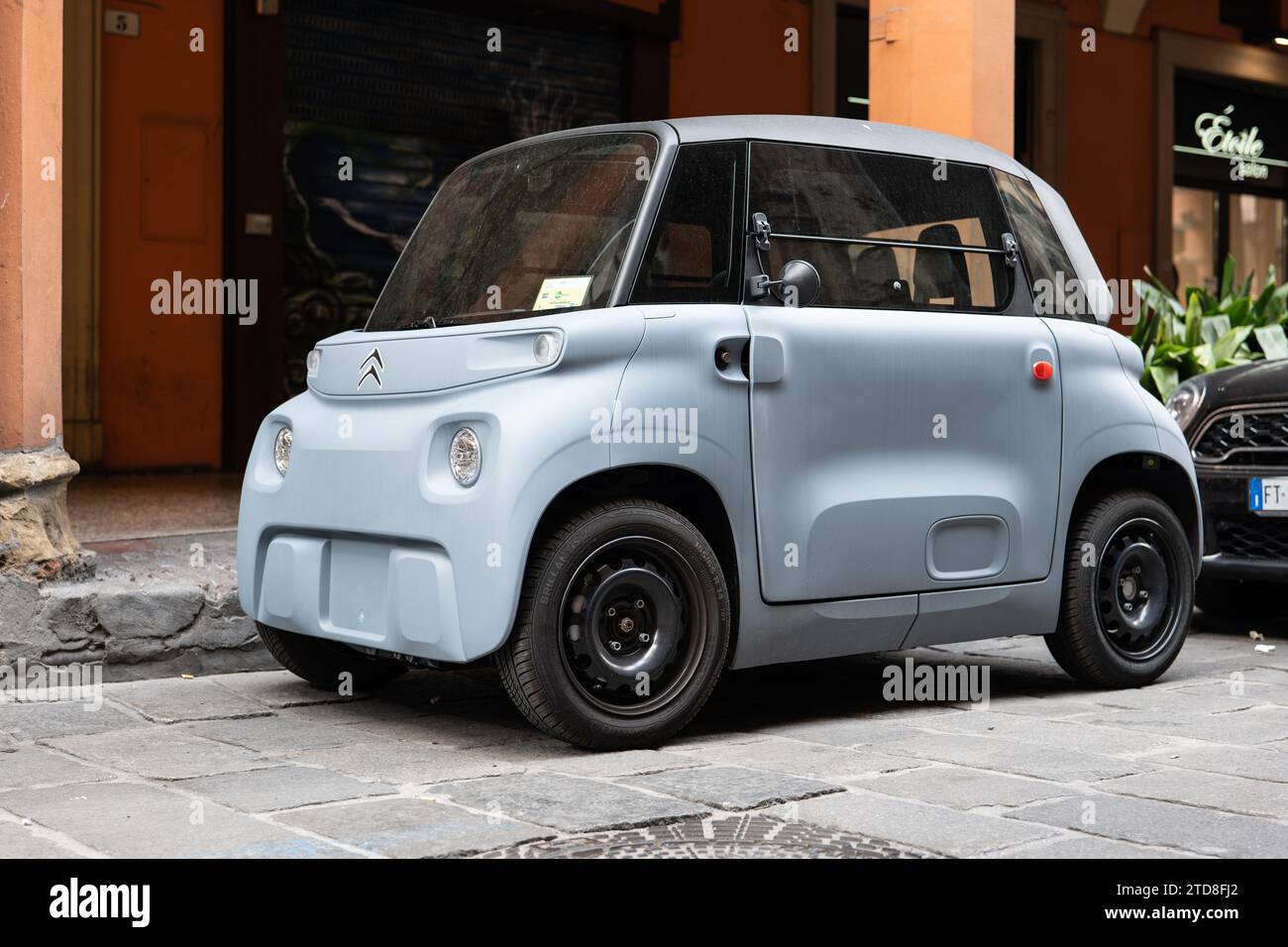 BOLOGNA, ITALY - APRIL 20, 2022: Ugly Citroen Ami One electric mini car parked on a street of Bologna Stock Photo