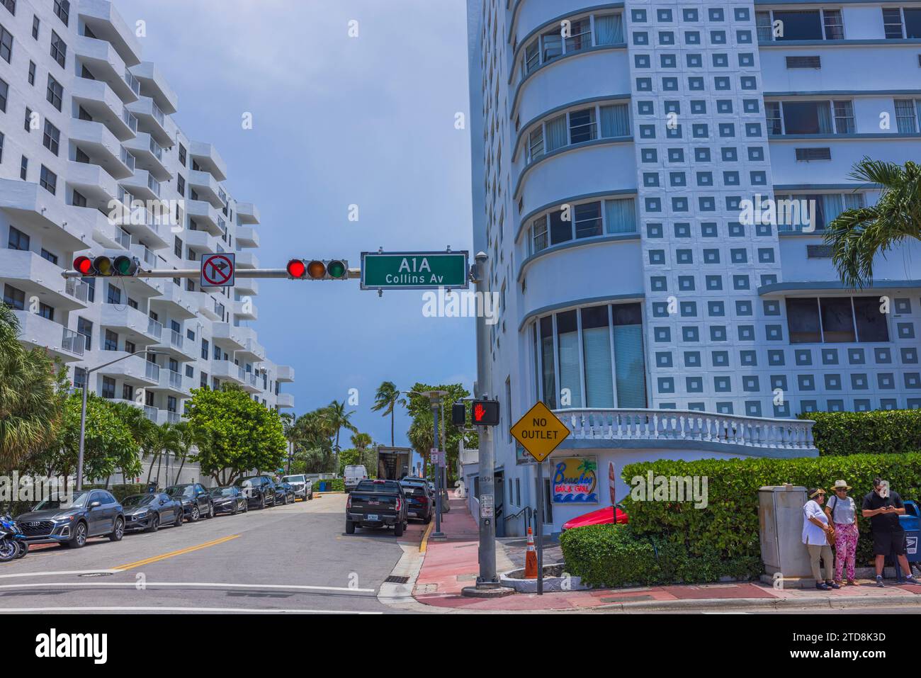 Urban landscape of one of the streets in Miami Beach with people standing at the intersection of Collins Avenue. USA. Stock Photo