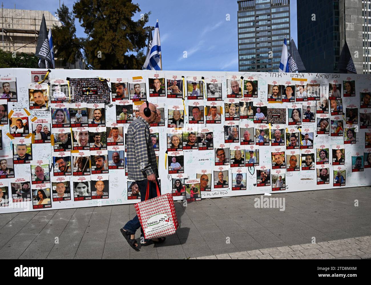 Tel Aviv, Israel. 16th Dec, 2023. A man walks by photos of Israeli hostages held captive by Hamas in Gaza at Hostage Square outside the Tel Aviv Museum in Tel Aviv, on Saturday, December 16, 2023. Israeli forces opened fire, killing three hostages mistaken for Hamas. Photo by Debbie Hill/ Credit: UPI/Alamy Live News Stock Photo